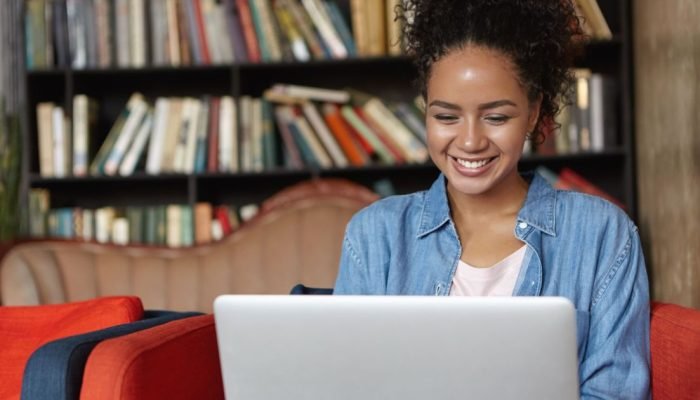 woman-sitting-library-with-her-laptop.jpg